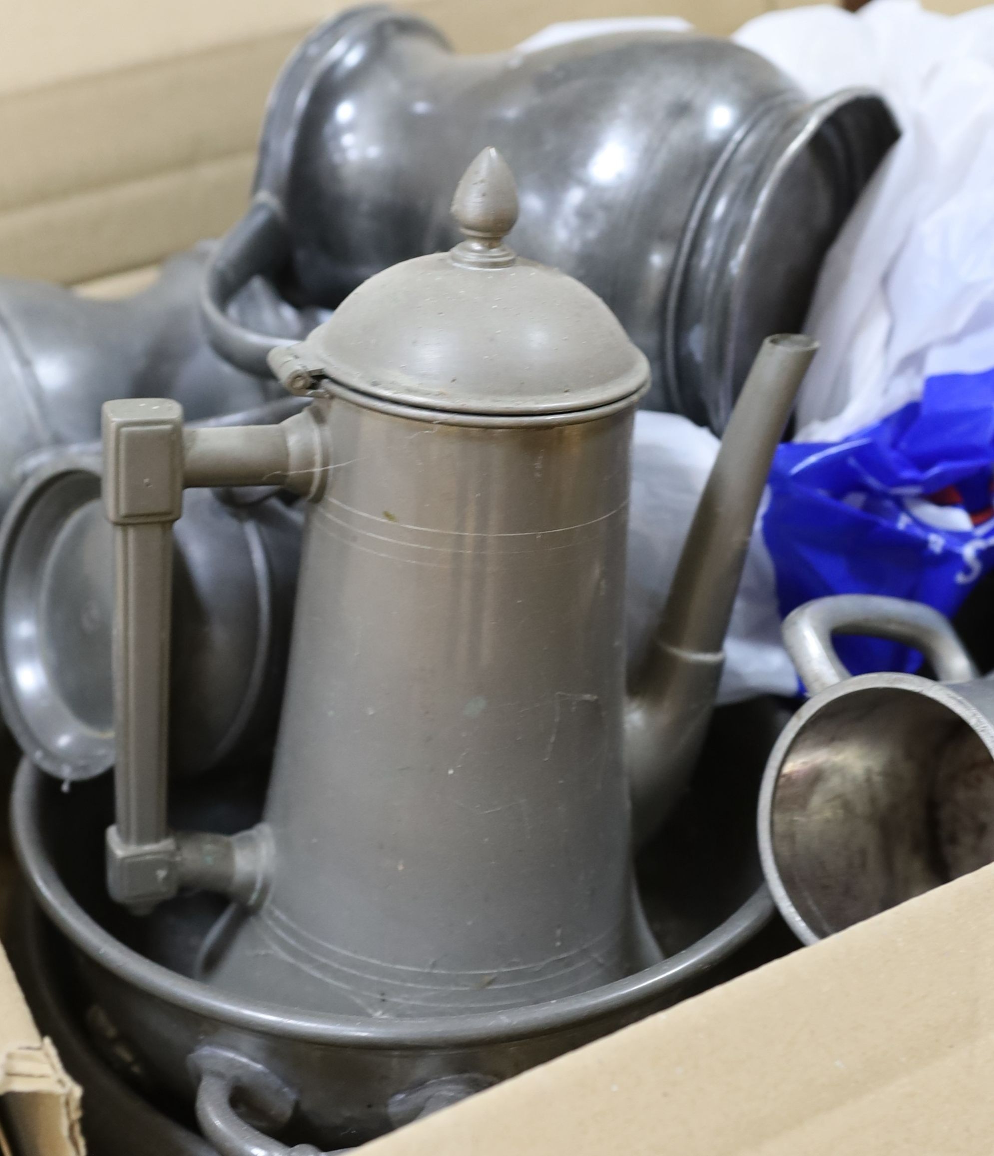 A quantity of pewter jugs and wares